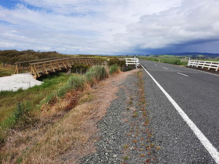 Hauraki Rail Trail bridge and East Coast Road bridge over Te Puaeharuri (drain) Stream